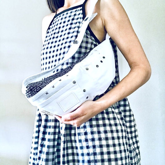 Woman carrying a white denim handbag made with upcycled denim and sustainable fabric in Australia