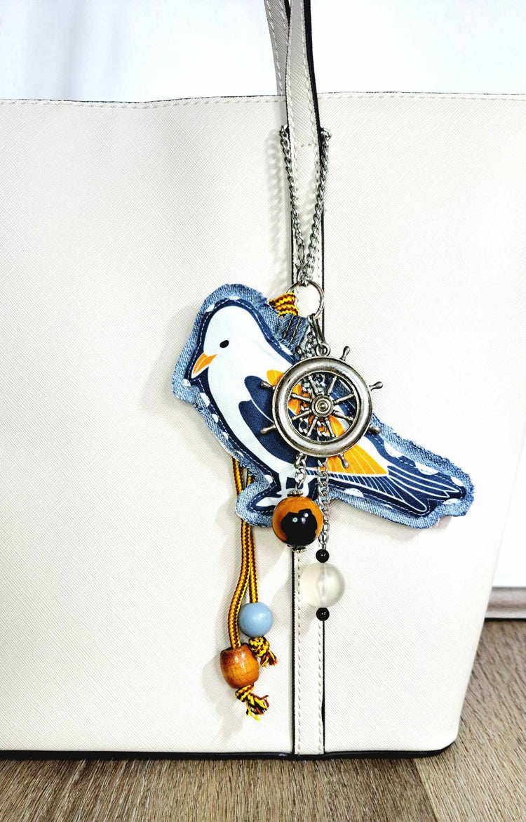 denim bag charm with seagull maritime boat wheel  beads and vintage necklace