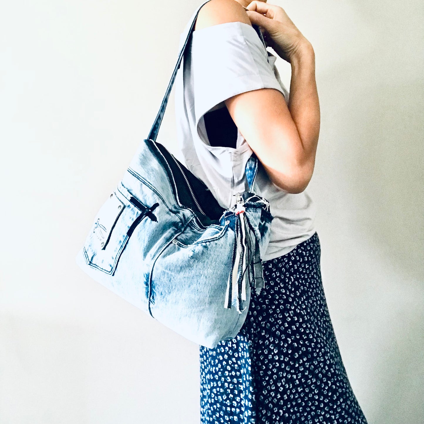 Conscious Carry-all with light blue denim and Paris lining with upcycled tassle