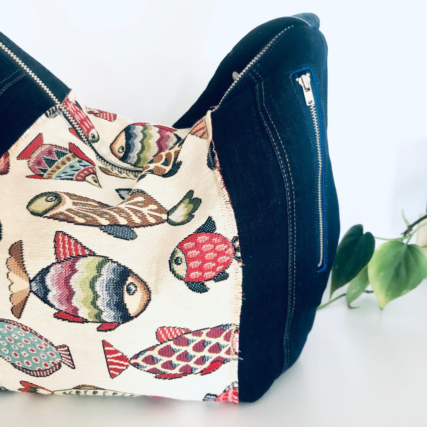 Upcycled denim hobo bag with festive fishes