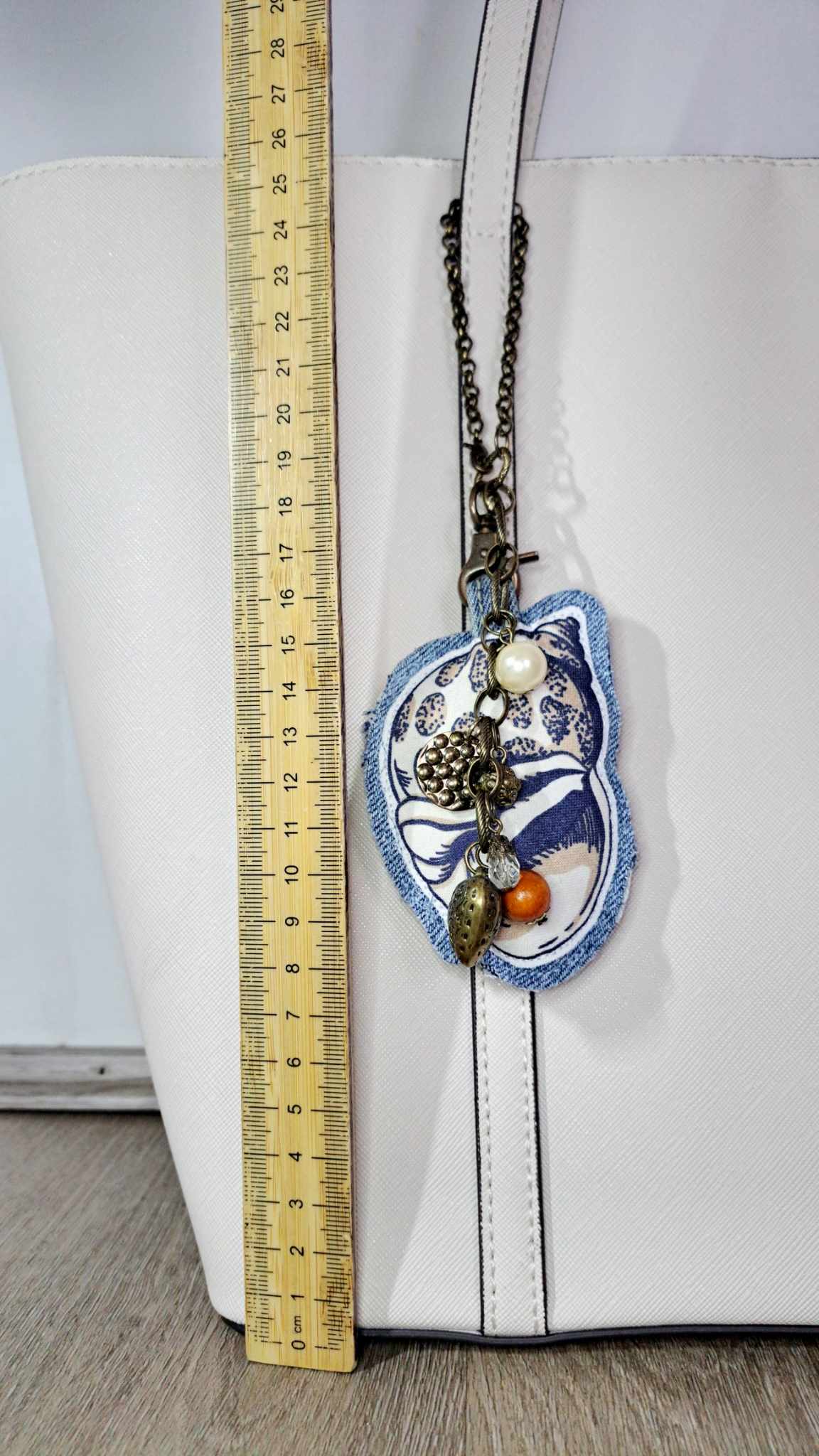 Ocean inspired upcycled denim and vintage necklace bag charm with cowrie pendant