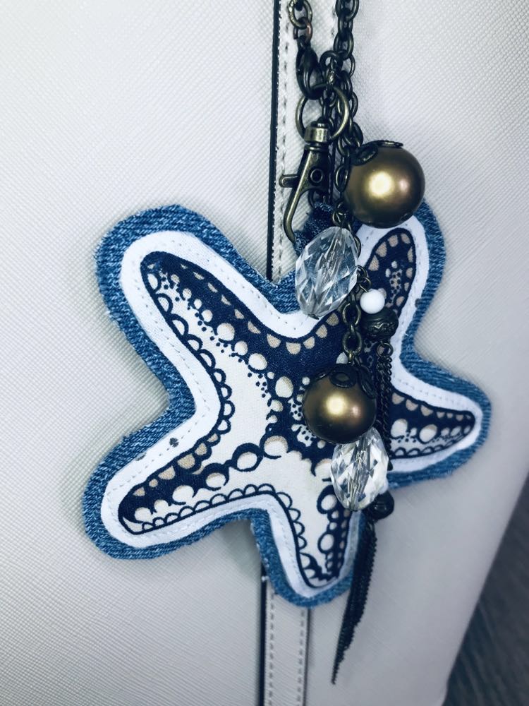 Ocean inspired upcycled denim and vintage necklace bag charm with seastar pendant