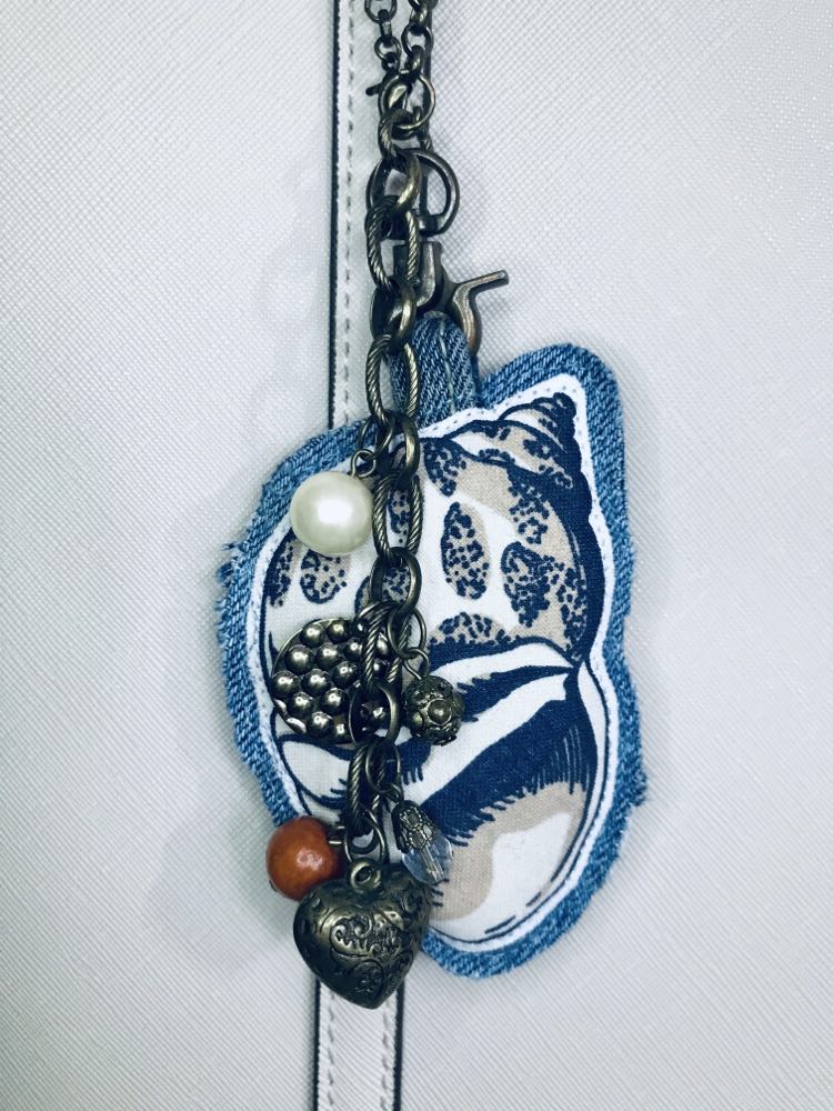 Ocean inspired upcycled denim and vintage necklace bag charm with cowrie pendant