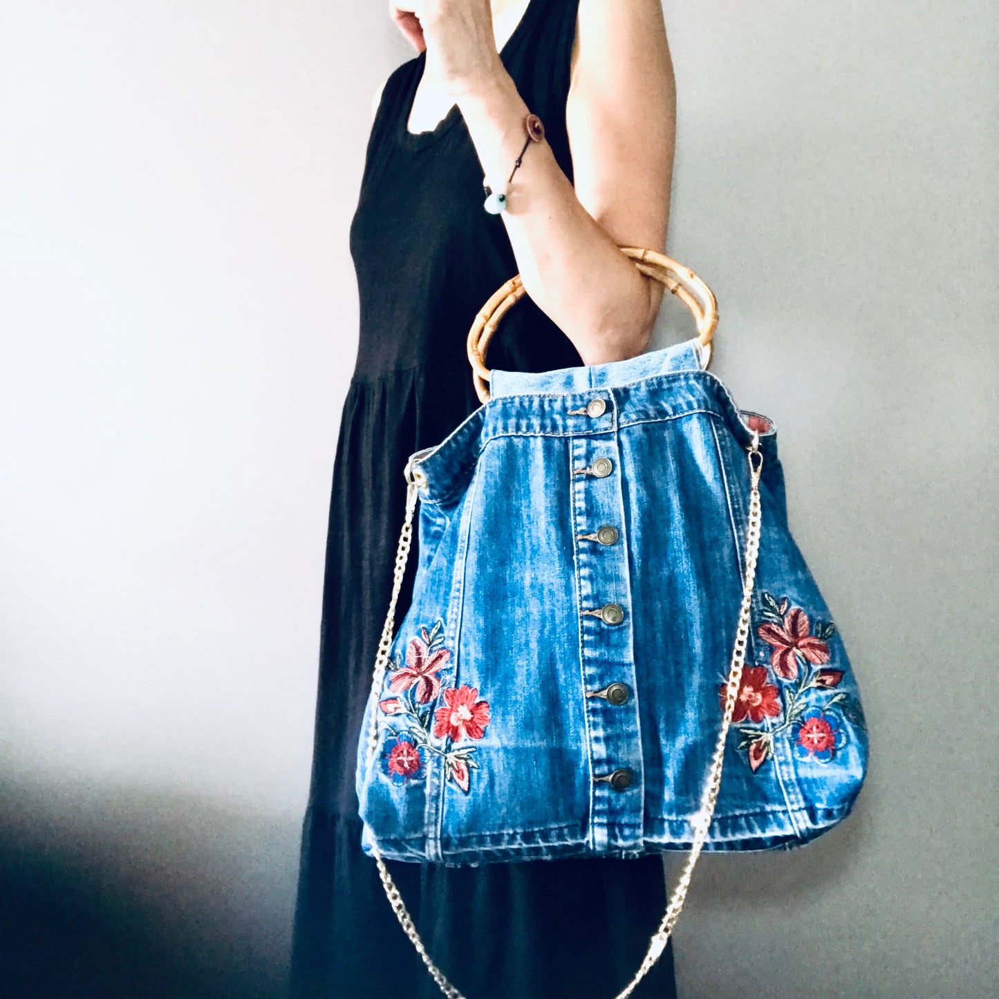 Embroidered boho handbag with cane handles and chain strap