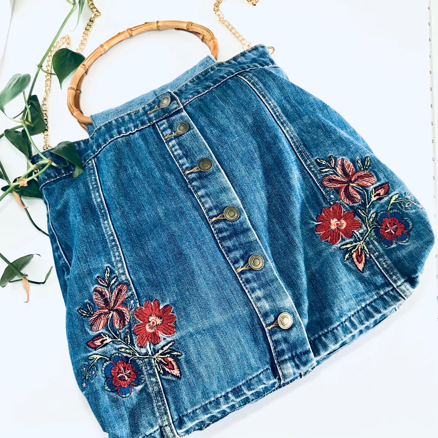 Embroidered boho handbag with cane handles and chain strap