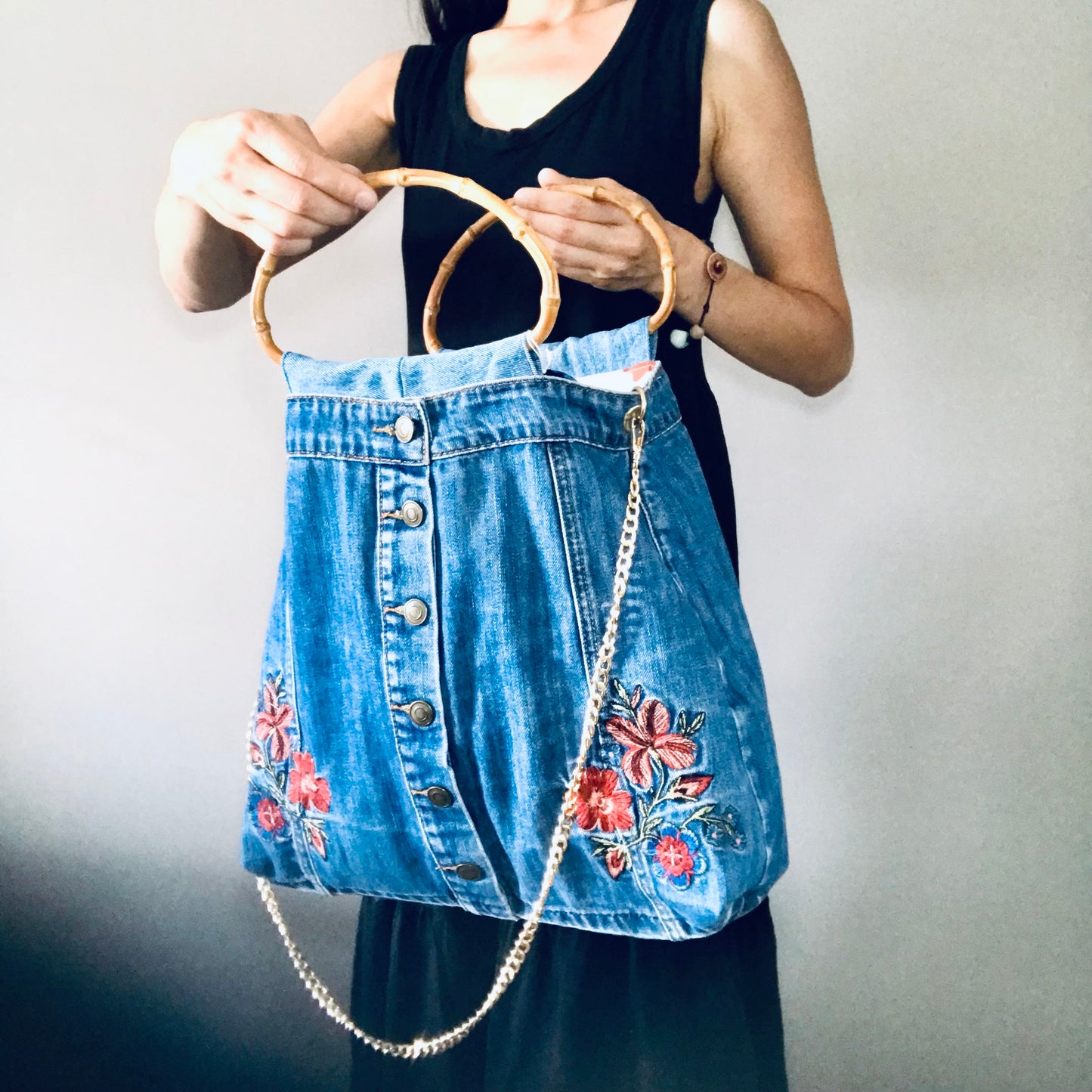 Embroidered boho handbag with cane handles and chain strap