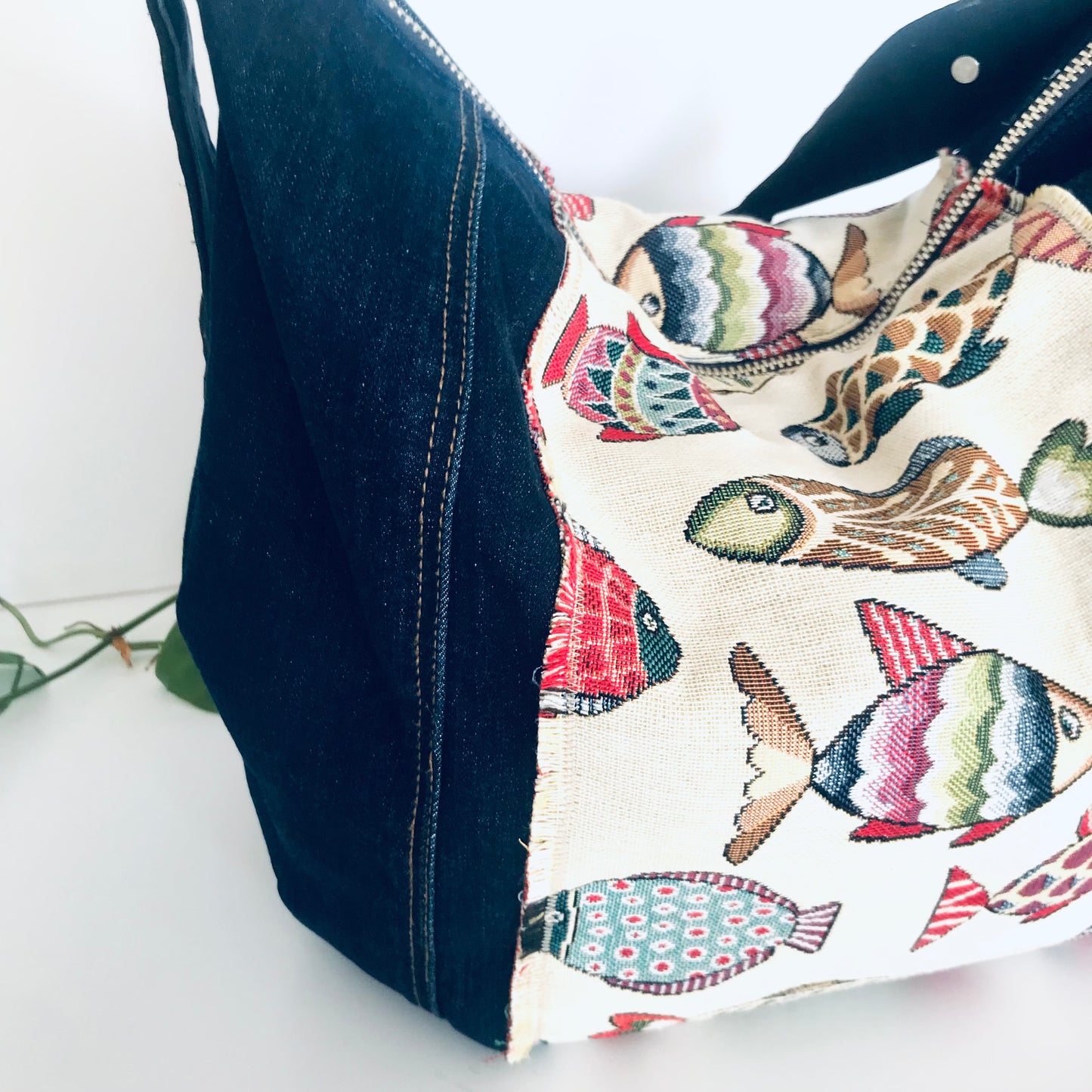 Upcycled denim hobo bag with festive fishes