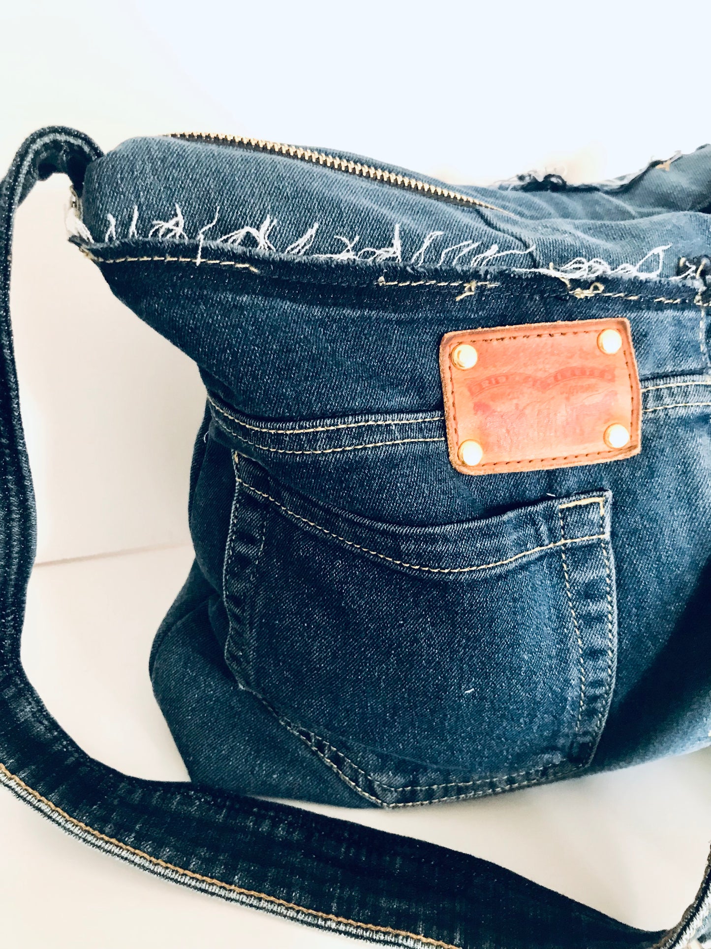 Conscious Carry-all with blue denim and upcycled tassle