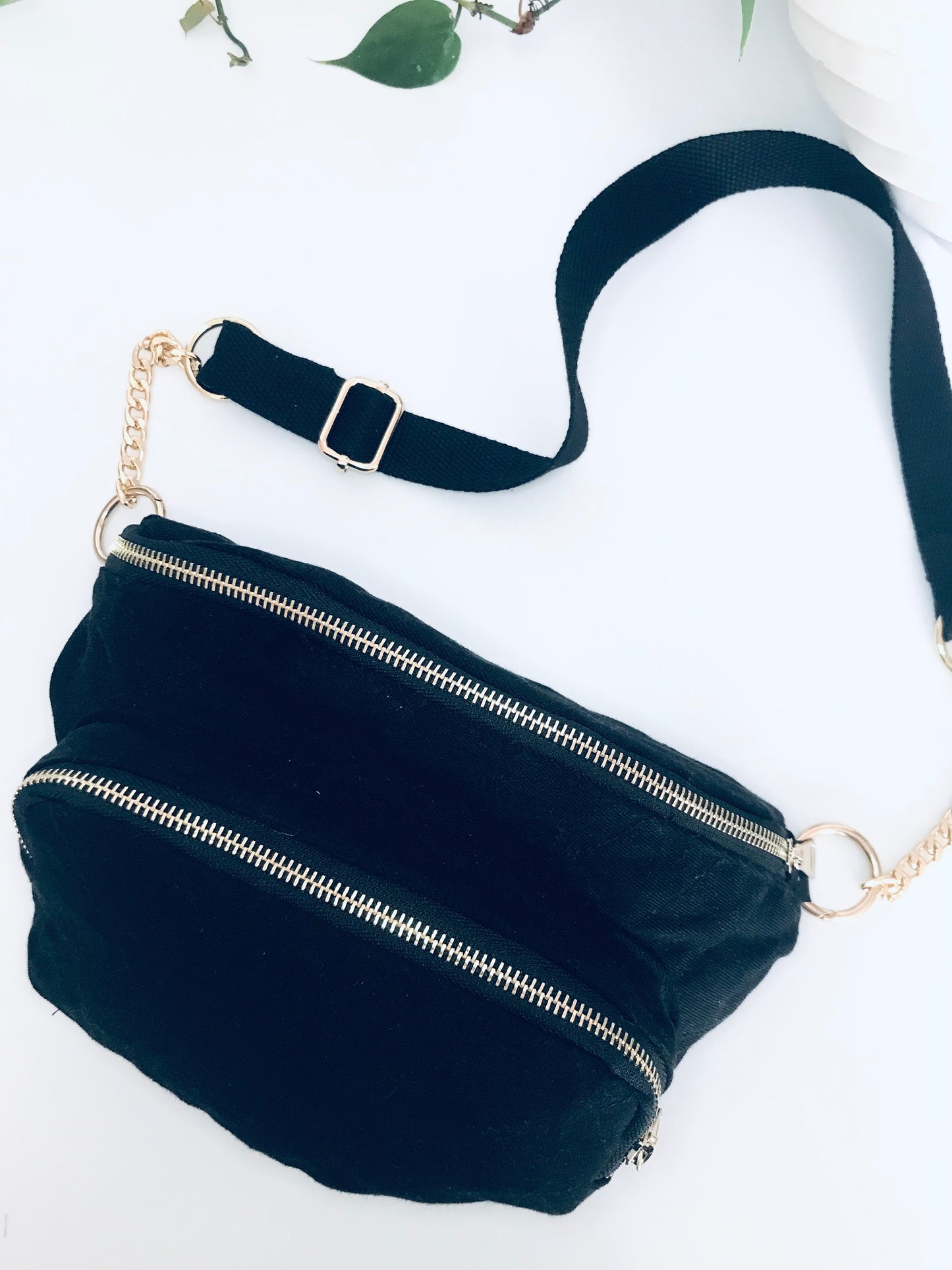 Black denim waist pack with gold chain detail