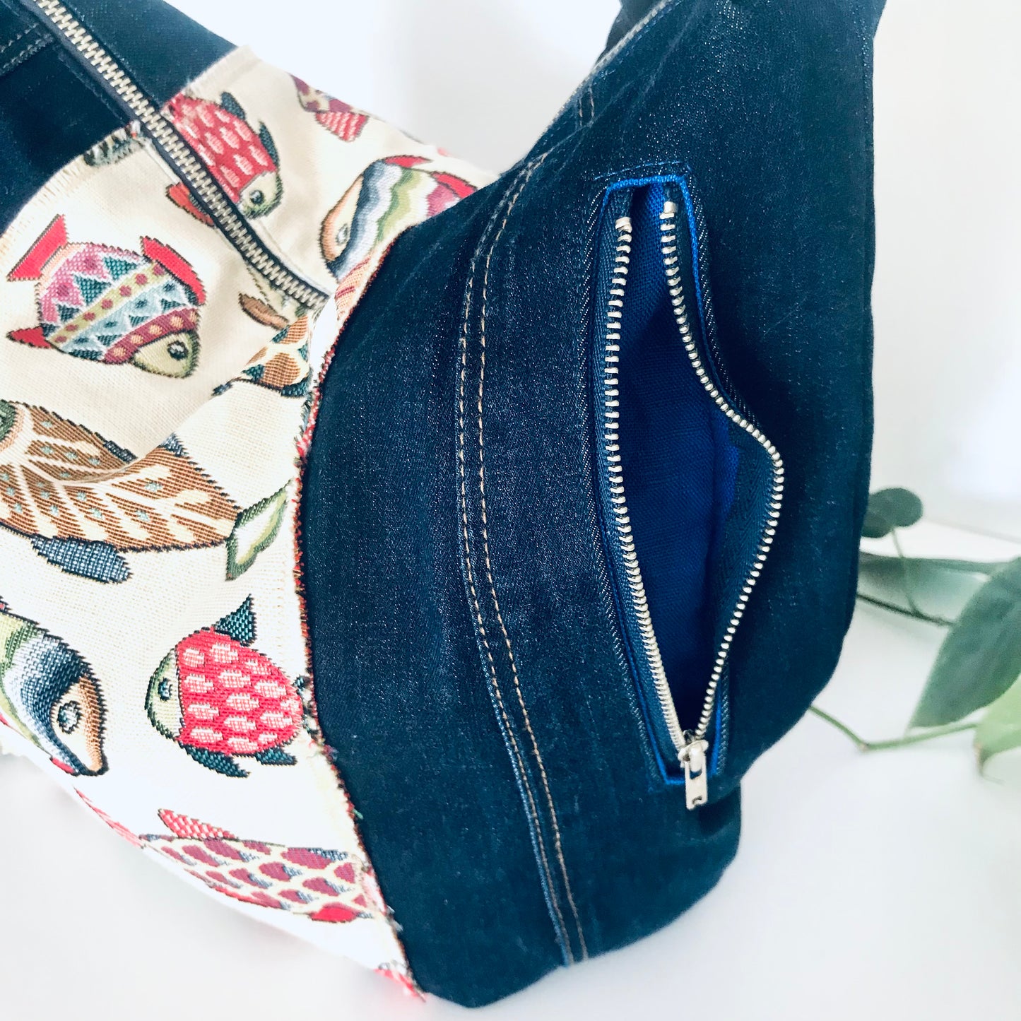 Upcycled denim hobo bag with festive fishes