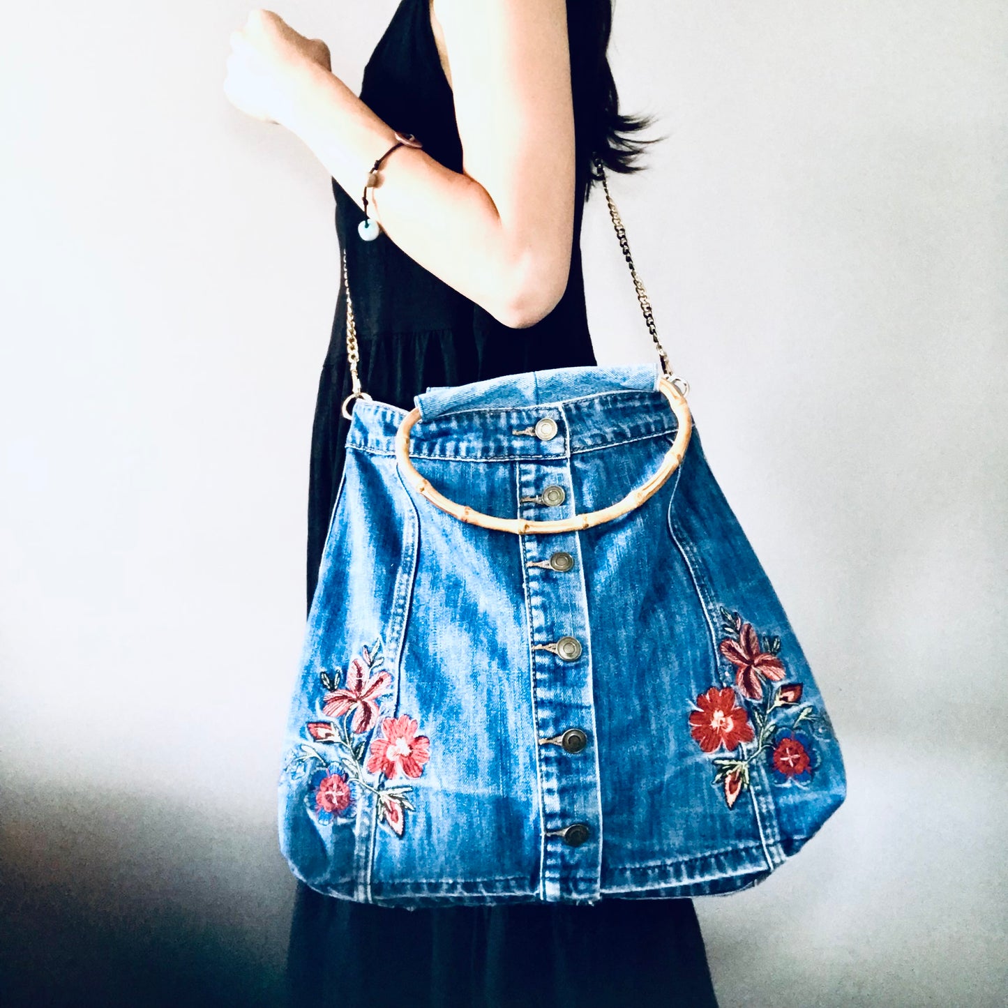 Embroidered boho handbag with cane handles and chain strap