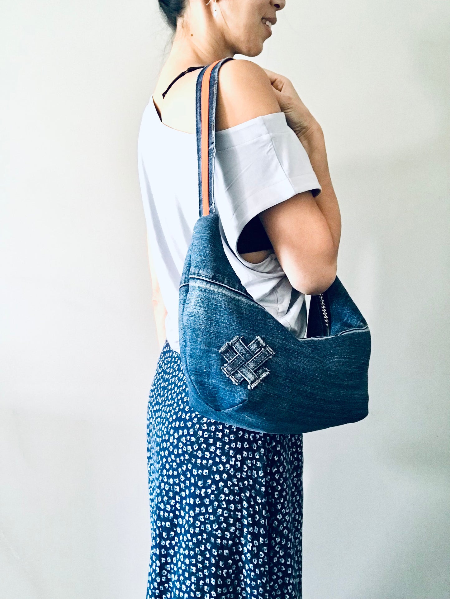 Hobo Zero with classic blue denim, orange trim and matching zipper pouch