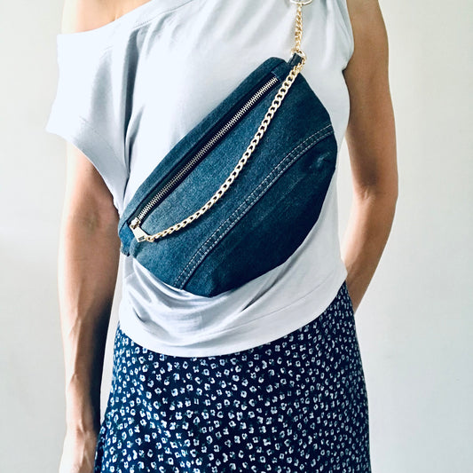 Indigo denim sling bag with gold chain detail