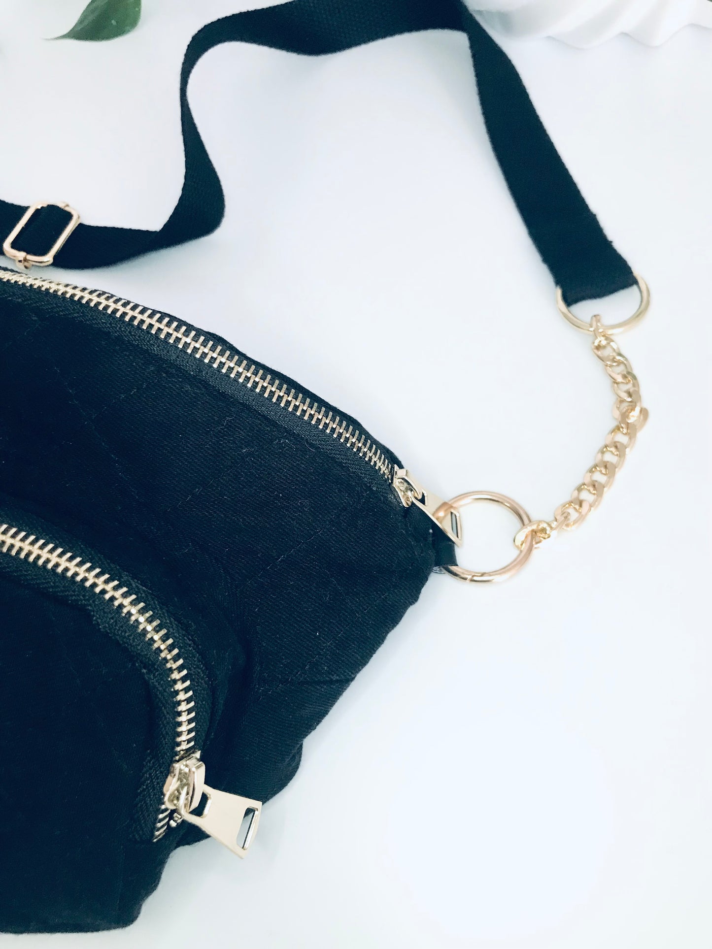 Black denim waist pack with gold chain detail