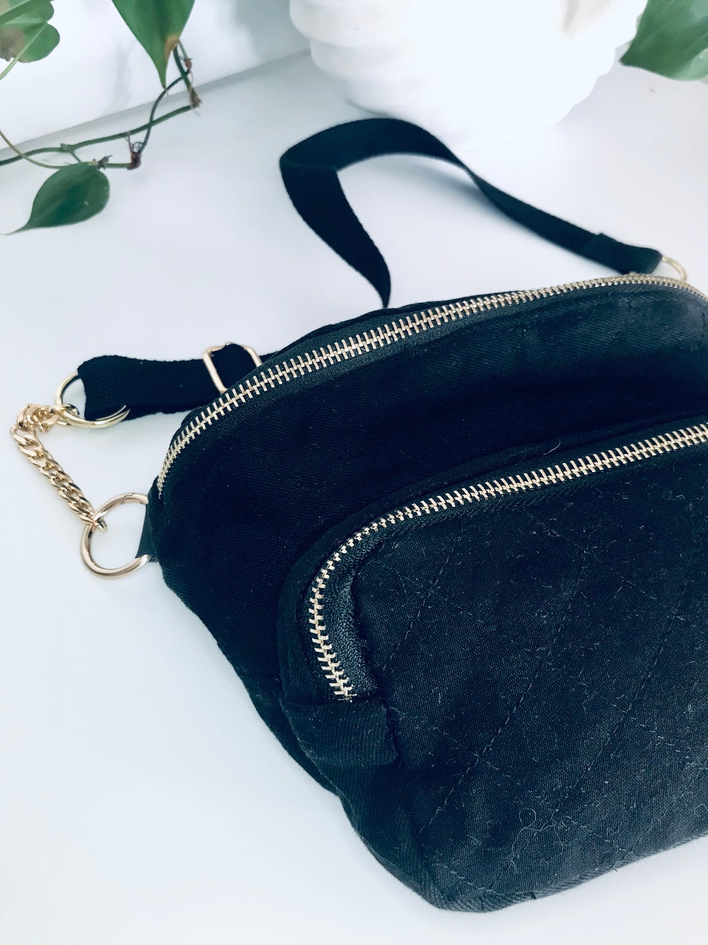 Black denim waist pack with gold chain detail