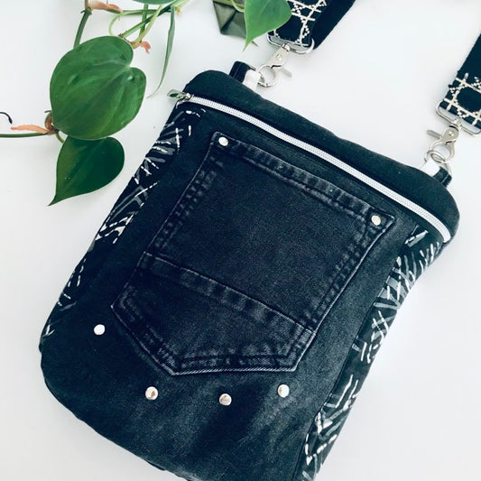 Upcycled crossbody everyday bag with black denim and black and white graphic lining