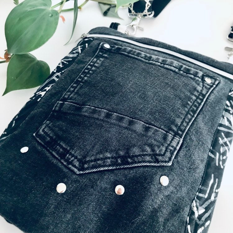 Upcycled crossbody everyday bag with black denim and black and white graphic lining