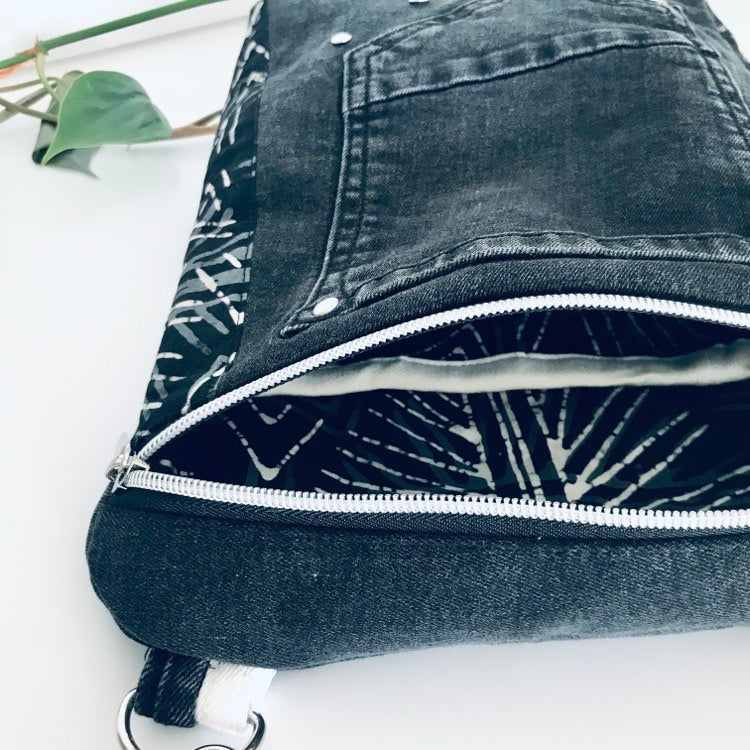 Upcycled crossbody everyday bag with black denim and black and white graphic lining