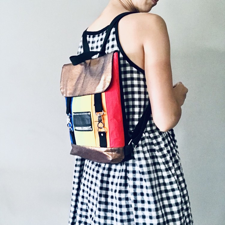 Rainbow backpack with black and bronze denim