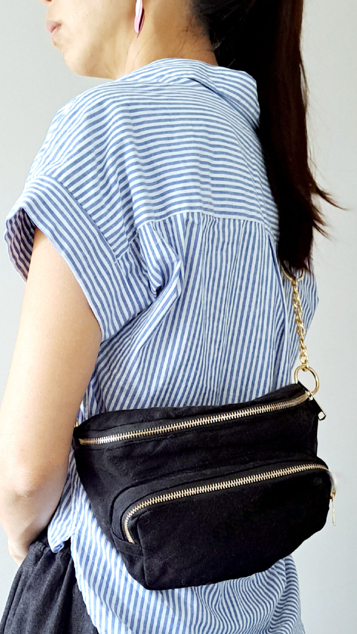 Black denim waist pack with gold chain detail